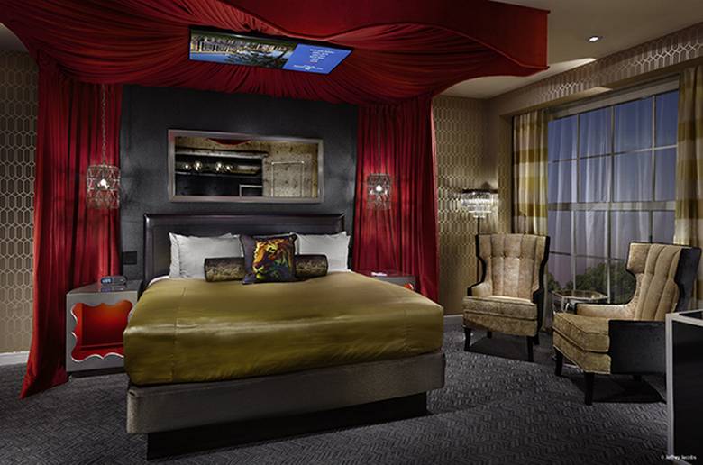 Kings_Suite_Gracelandbedroom_Bed | The Guest House at Graceland | The Guest House at Graceland The bedroom of the King’s Suite 1 features a TV mounted on the canopy over the bed. JEFFREY JACOBS